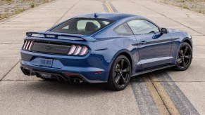 A blue 2023 Ford Mustang EcoBoost shows off its grand tourer styling and stealth package.