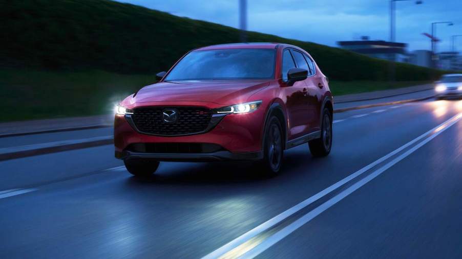A red 2022 Mazda CX-5 driving down the road.