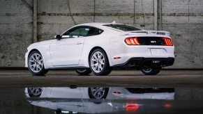 A pre-S650 S550 2023 Ford Mustang GT shows off its Ice White paint and rear-end styling.