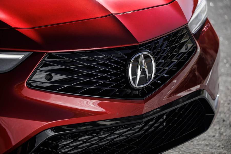 A red 2023 Acura Integra grille, which is the Acura sedan that is the best.