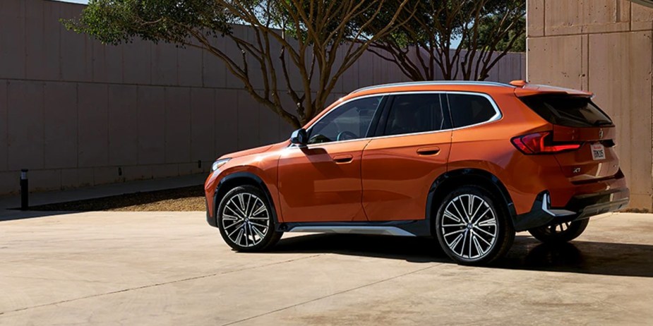 An orange 2023 BMW X1 subcompact SUV. 
