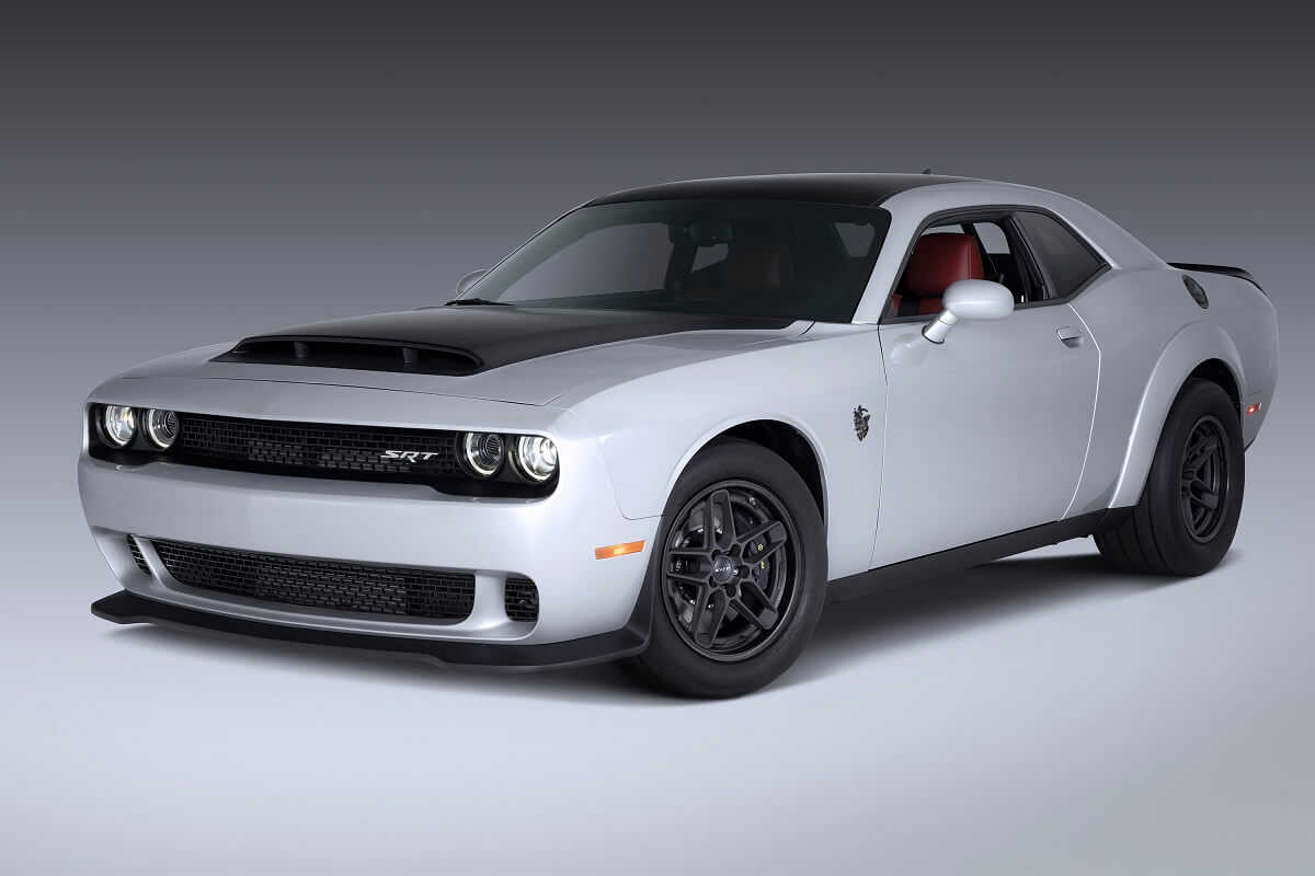 A silver and black 2023 Dodge Challenger SRT Demon 170 poses at a photo shoot.