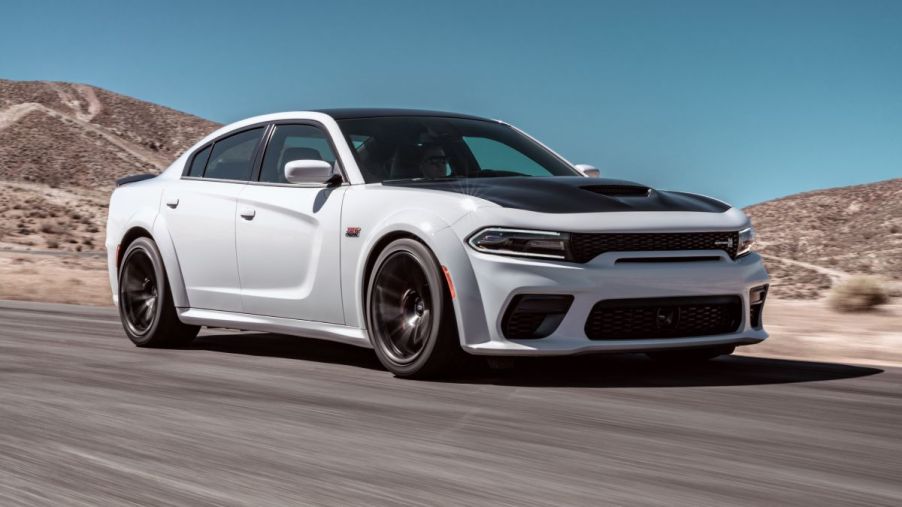 A 2023 Dodge Charger Scat Pack Widebody darts around a track