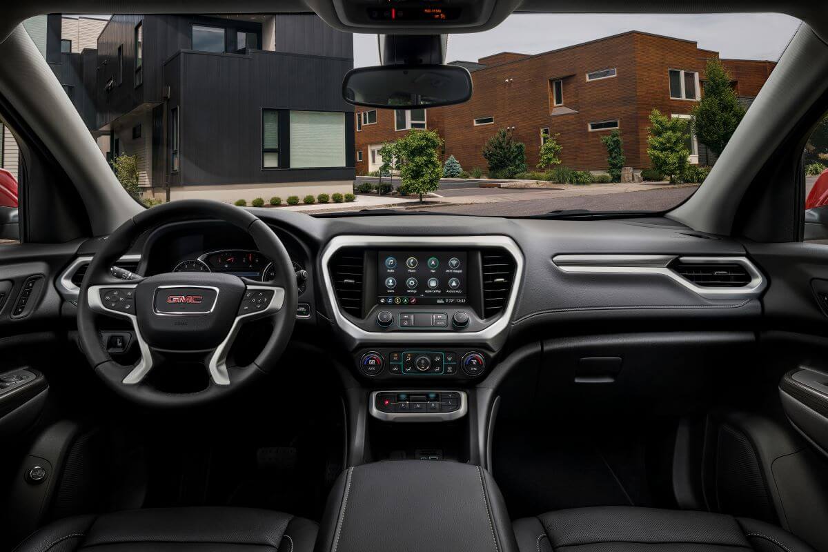Interior front row view of a 2023 Acadia SLT midsize SUV model window visibility