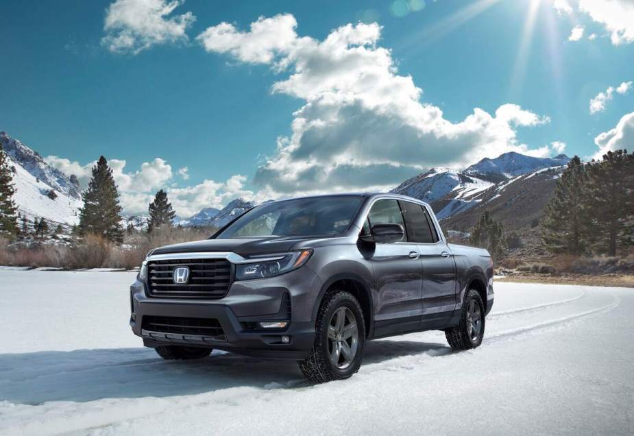 A 2023 Honda Ridgeline parked outdoors in a snowy environment.