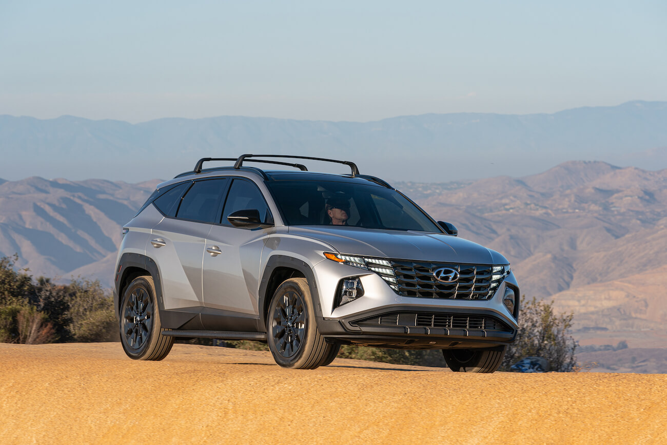 Silver 2023 Hyundai Tucson on a valley cliff. The Tucson is one of the most popular Hyundai SUVs.