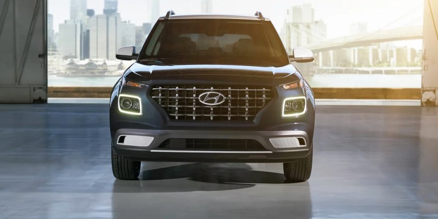 A blue 2023 Hyundai Venue Limited subcompact SUV is parked.
