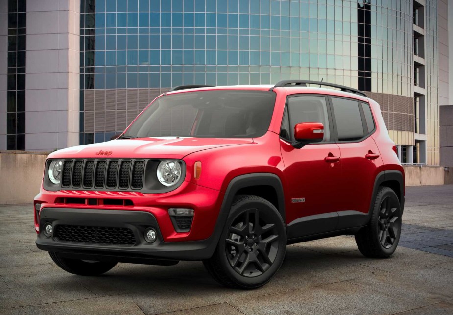 Red 2023 Jeep Renegade in front of a building shown from the front 