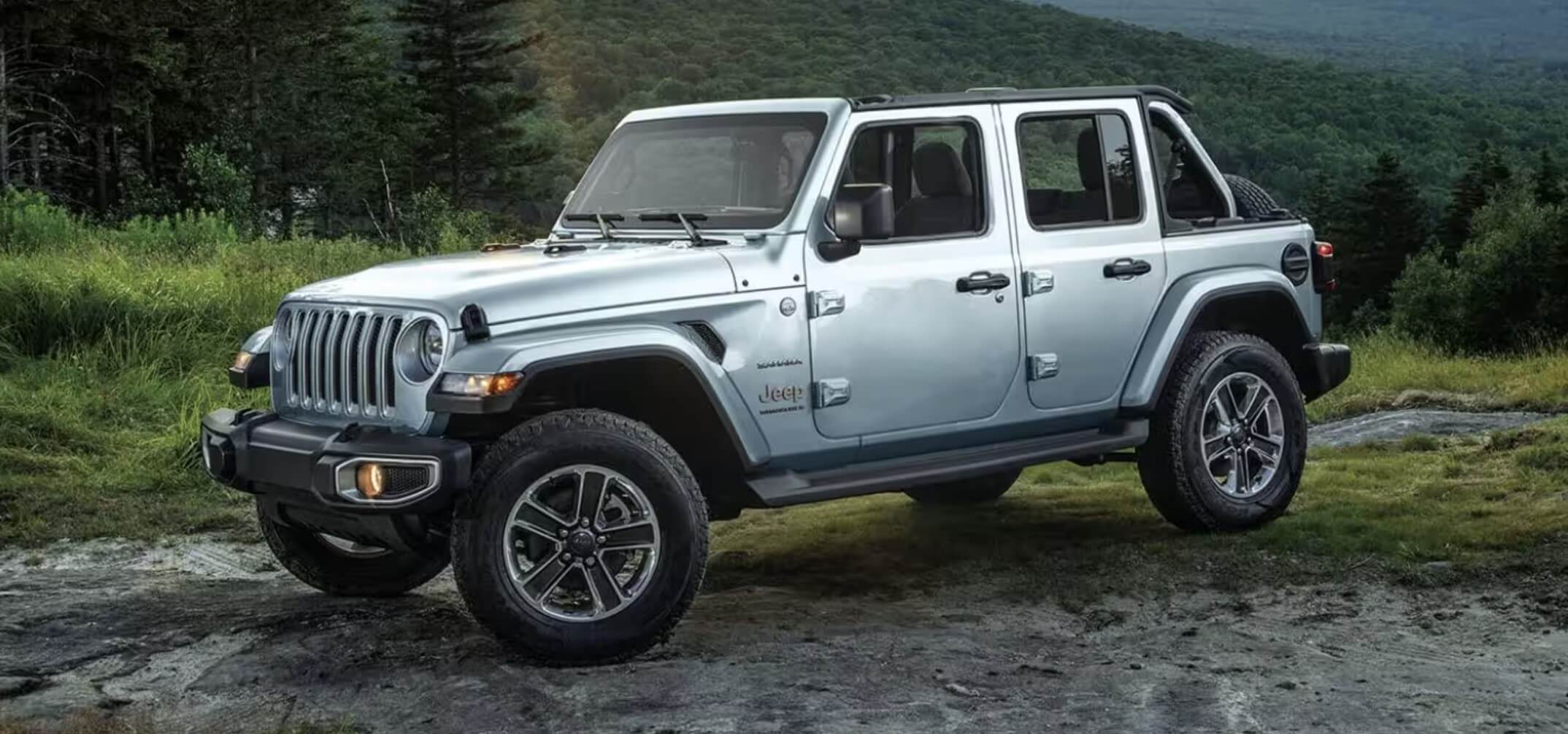 The 2023 Jeep Wrangler driving down the road