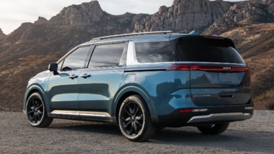 2023 Kia Carnival Parked with Mountains in the Background