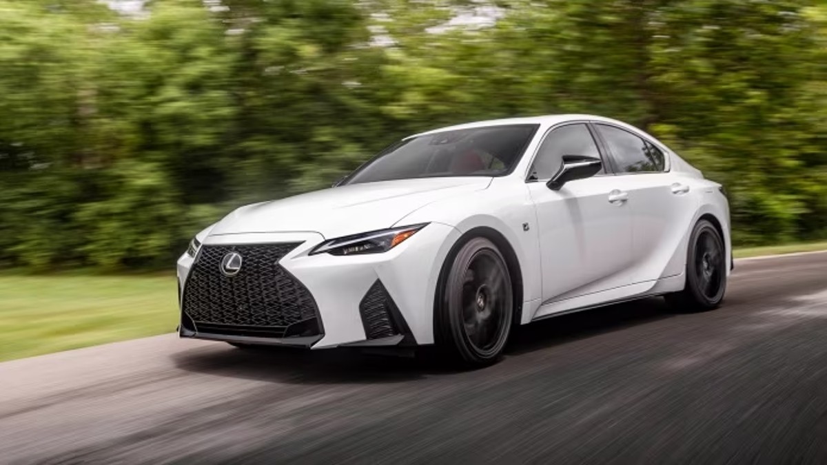 2023 Lexus IS driving on a country road.
