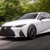 2023 Lexus IS driving on a country road.