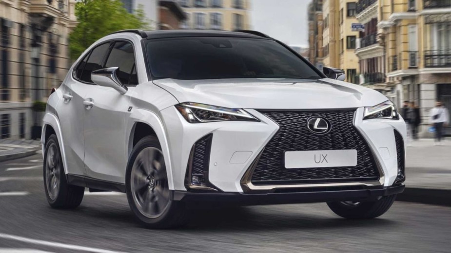 White 2023 Lexus UX parked on a street