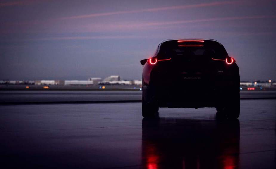 A 2023 Mazda CX-30 parked outdoors in the shadows.