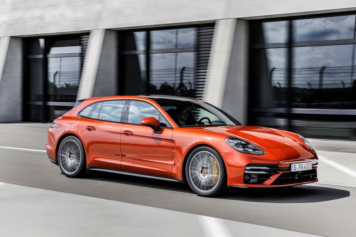 An orange Porsche Panamera Turbo S is one of the best luxury cars of 2023