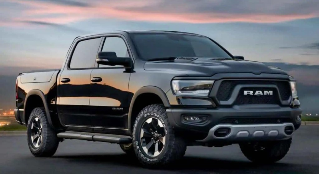 A black 2023 Ram 1500 parked at dusk