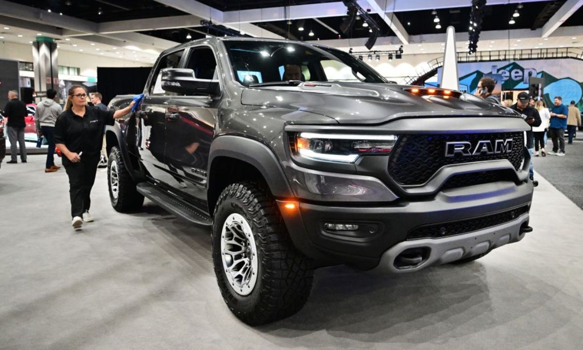 A 2023 Ram 1500 on display at an auto show.
