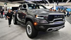 A 2023 Ram 1500 on display at an auto show.
