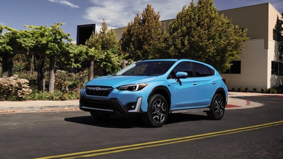 A safe, small 2023 Subaru Crosstrek shows off liftback car proportions with bright blue paintwork.