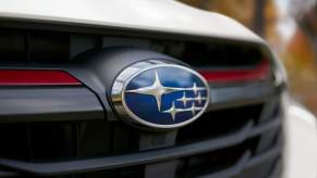 A 2023 Subaru Legacy, one of the best Subaru sedans, focusing on the logo on the grille.