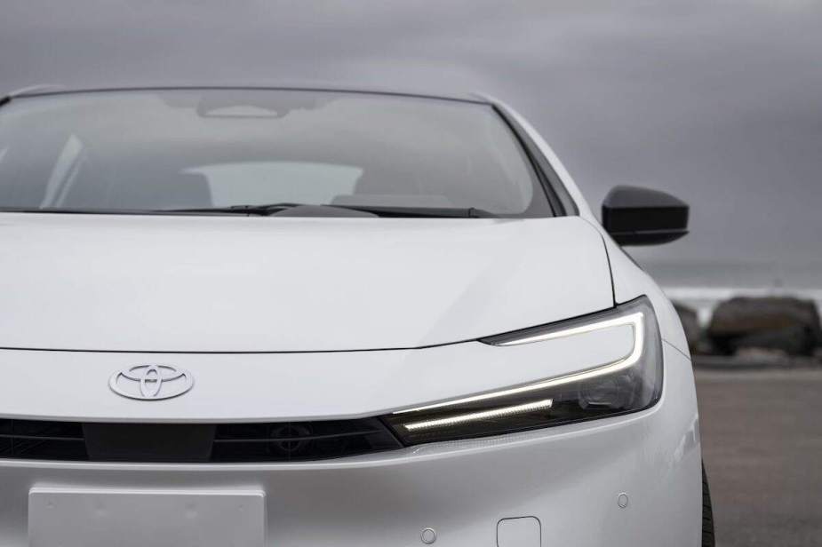 A white 2023 Toyota Prius close up, which is one of the best affordable cars in 2023.