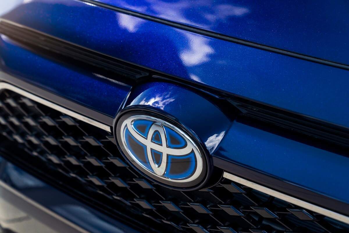 A blue 2023 Toyota RAV4 Prime grille with the Toyota logo. The RAV4 Prime is one of the top Toyota vehicles.