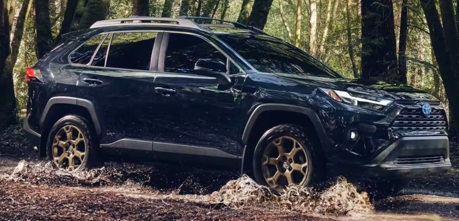 2023 Toyota RAV4 Woodland Edition Midnight Black Metallic Splashing Through the Mud