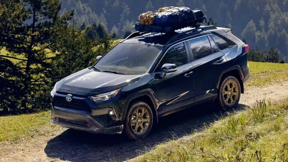 2023 Toyota RAV4 on an Outdoor Trail With a Fully Loaded Roof Rack