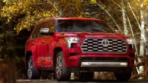 A red 2023 Toyota Sequoia full-size SUV is parked.