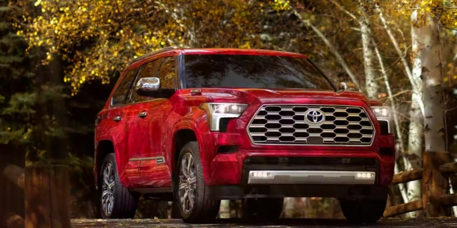 A red 2023 Toyota Sequoia full-size SUV  is parked. 
