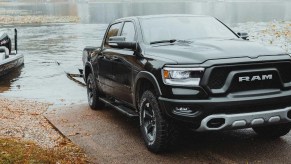 A 2023 Ram 1500 crew cab tows a boat out of water.