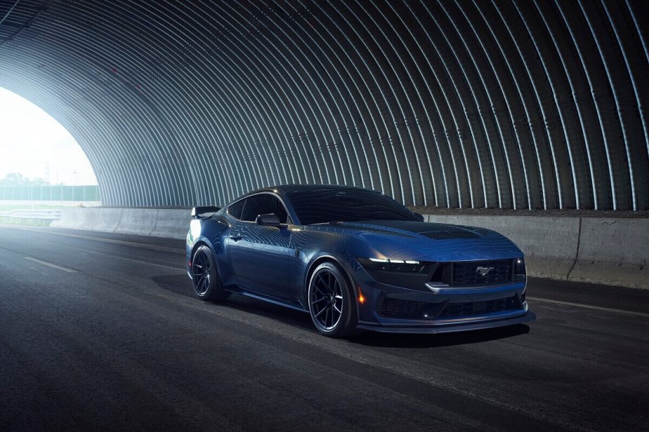A 2024 Ford Mustang Dark Horse shows off its styling and Blue Ember paint. 