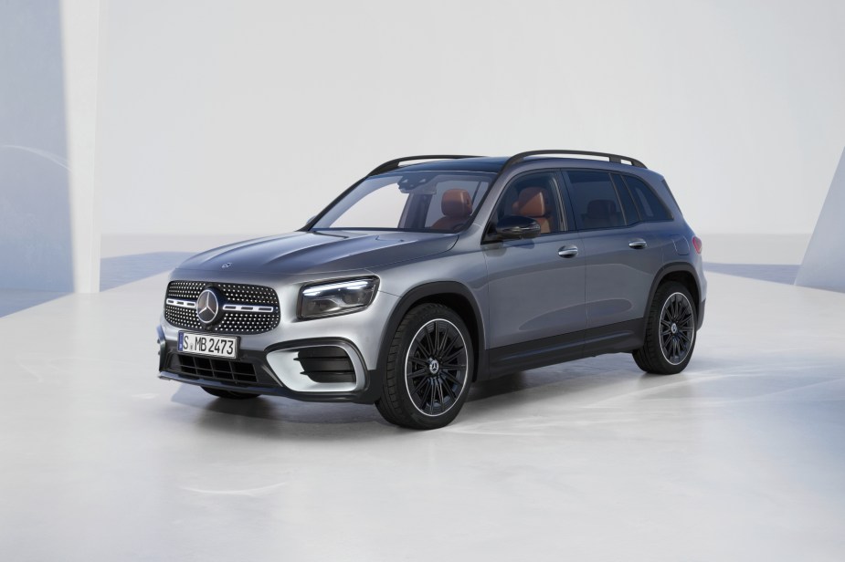 A silver 2024 Mercedes-Benz GLB with a white backdrop.