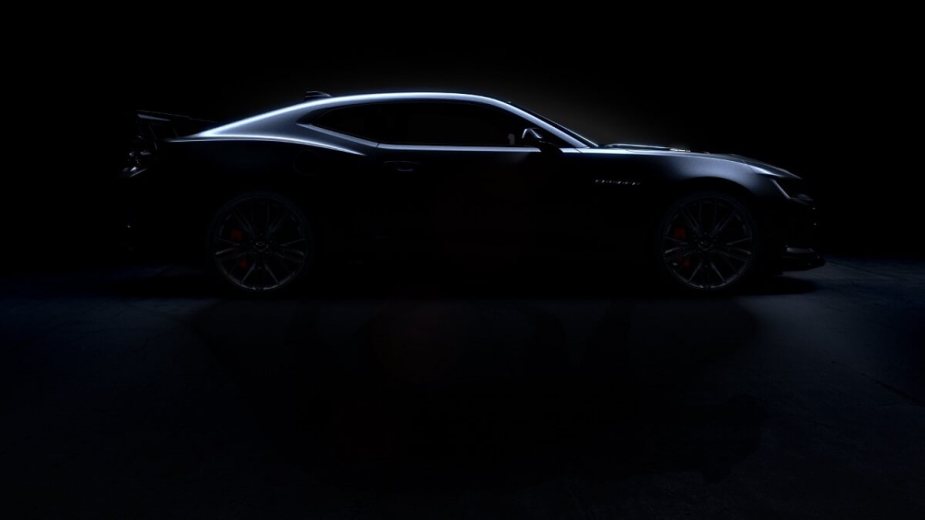 A new Chevy Camaro Collector's Edition on the ZL1 1LE platform poses in the dark.