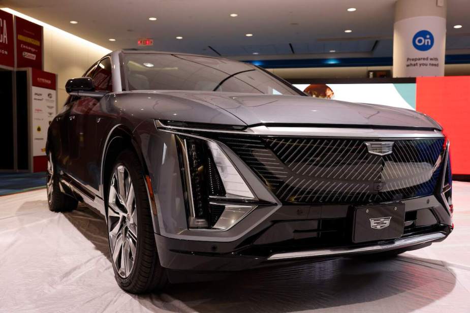 A dark color Cadillac Lyriq parked indoors.