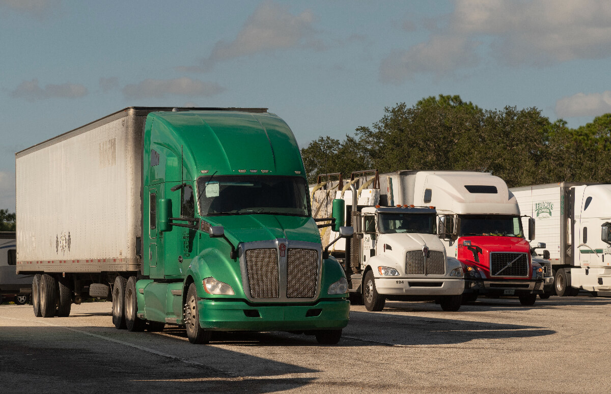 A group of semi-trucks parked, diesel trucks could be illegal in California soon.