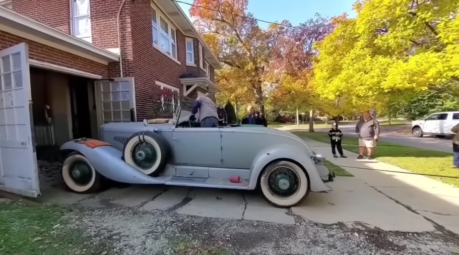 1931 Duesenberg Model J being pulled out of a garage