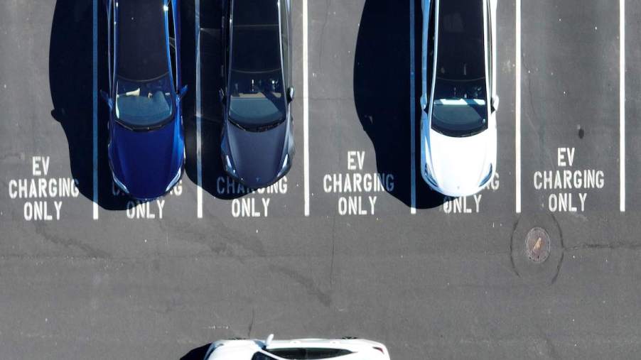 A row of EV charging stations with parking lots that read EV charging only.