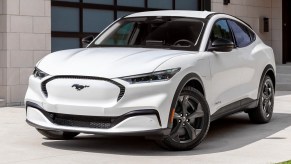A white 2023 Ford Mustang Mach-E small electric SUV is parked.