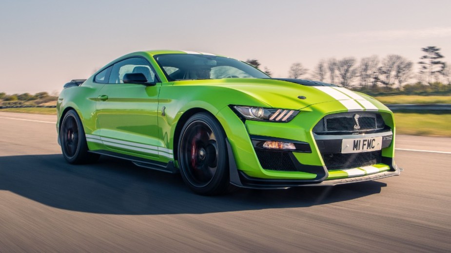 Green Ford Mustang Shelby GT500 on a track