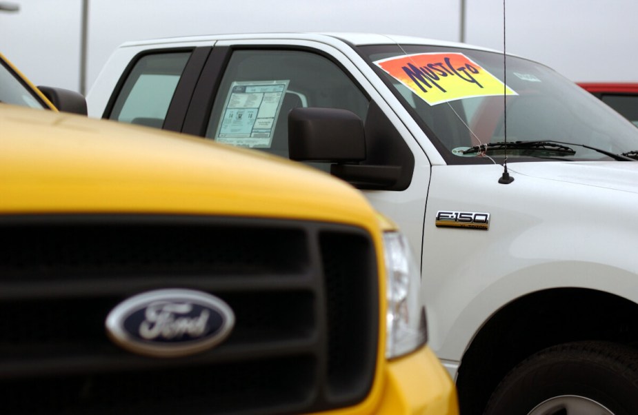 A Ford F-150 full-size truck sits on a dealership lot.