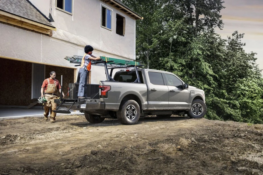 Ford's electric truck, the 2023 F-150 Lightning has items loaded into its bed.