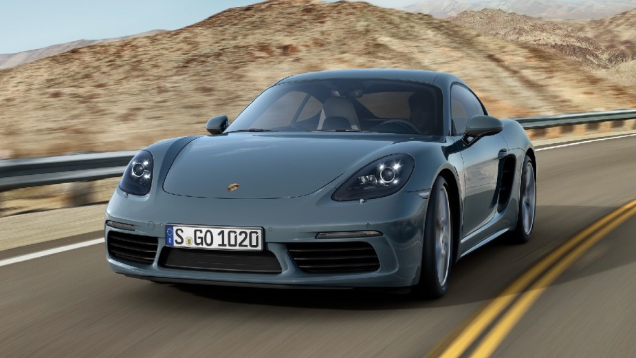 Front angle view of blue 2023 Porsche 718 Cayman, second-best new 2023 sports car, says Car and Driver