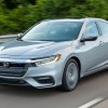 Front angle view of silver 2022 Honda Insight, cheapest new Honda hybrid car, but will be killed