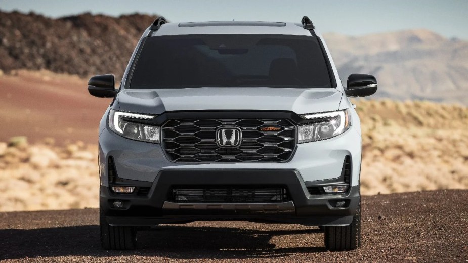 Front view of gray 2023 Honda Passport midsize SUV, most reliable Honda car, not Civic or Accord, says Consumer Reports