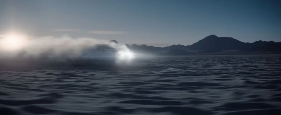 The 2022 GMC Hummer EV obfuscated by a cloud of dust in a GMC Hummer commercial.  