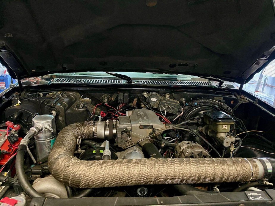The turbocharged Buick Grand National V6 in the engine bay of a GMC Syclone AWD supertruck.