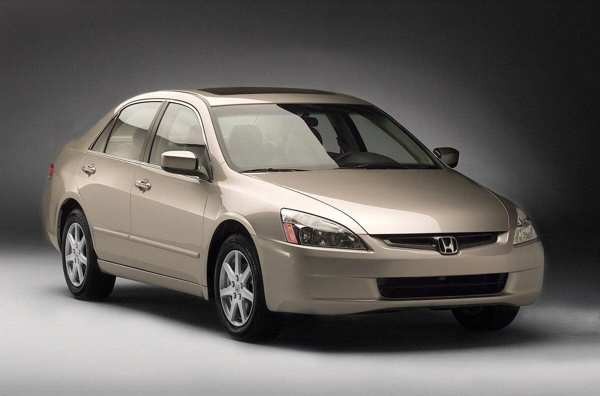 A gold 2003 Honda Accord poses for a photoshoot.