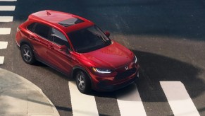 A red 2023 Honda HR-V is crossing an intersection.