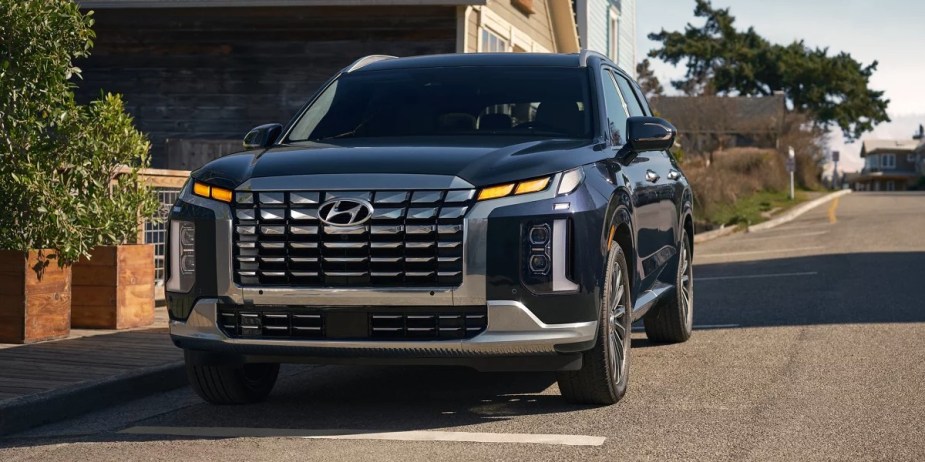 A blue 2023 Hyundai Palisade Calligraphy midsize SUV. 